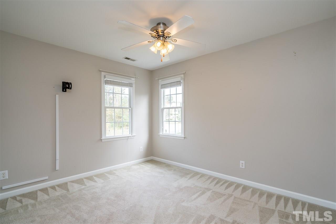 501 Woodland Road Raleigh, NC 27603 - Photo 8 of 28 a view of an empty room with a window