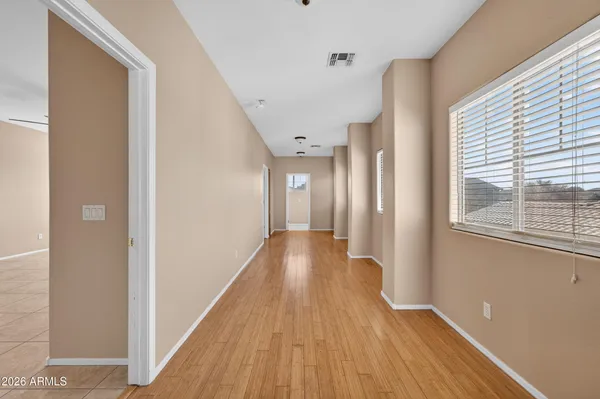 a view of gallery with wooden floor