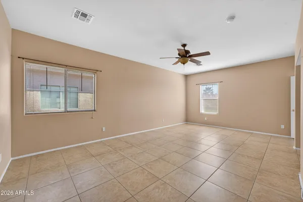 a view of an empty room with a window