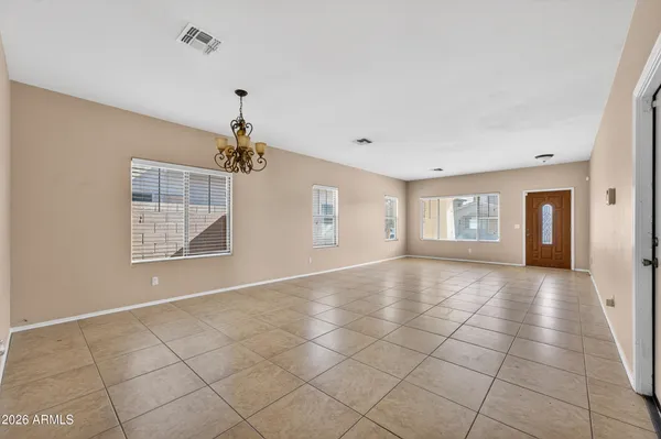 a view of an empty room with glass door