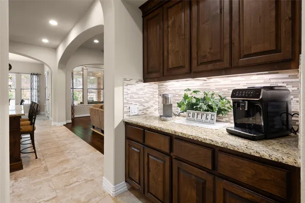 a kitchen with stainless steel appliances kitchen island granite countertop a stove and refrigerator
