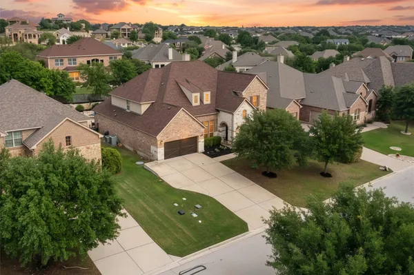 an aerial view of a house with a garden