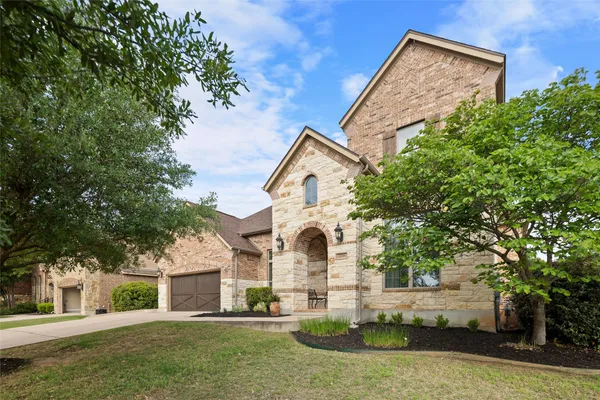 front view of a house with a yard