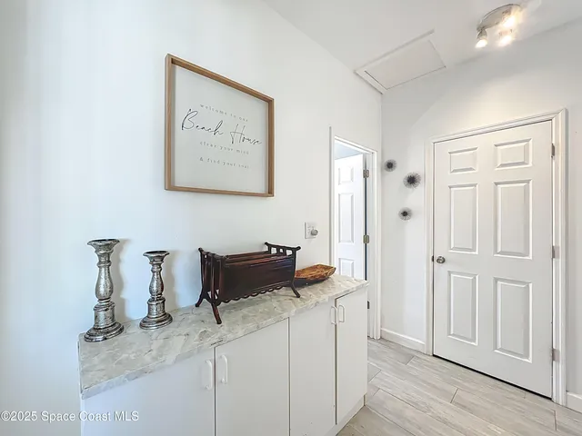 a bathroom view of a toilet and a glass door