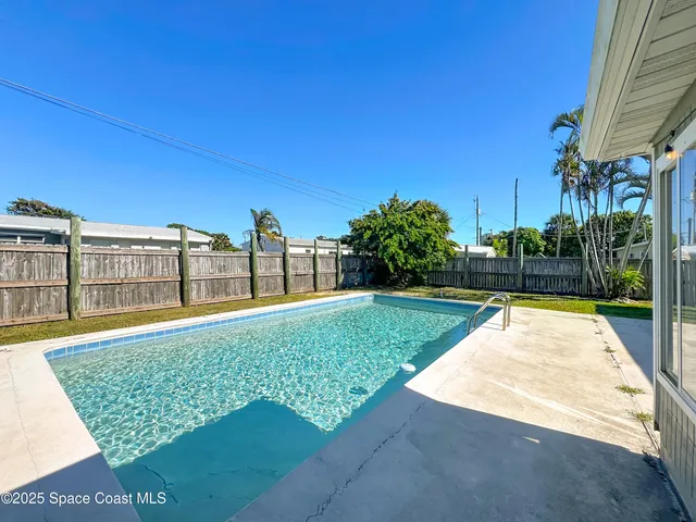 a view of a house with swimming pool