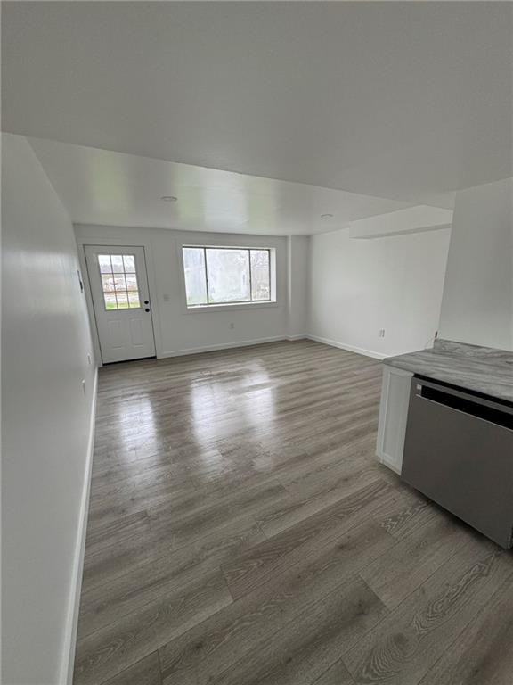 216 East Jackson Street Houston, PA 15342 - Photo 6 of 14 wooden floor in an empty room with a window