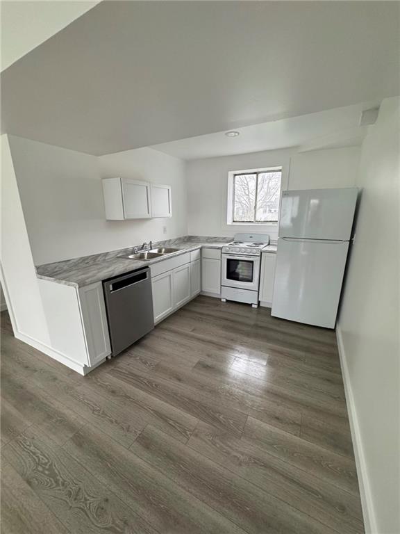 216 East Jackson Street Houston, PA 15342 - Photo 9 of 14 a kitchen with granite countertop a stove top oven and sink