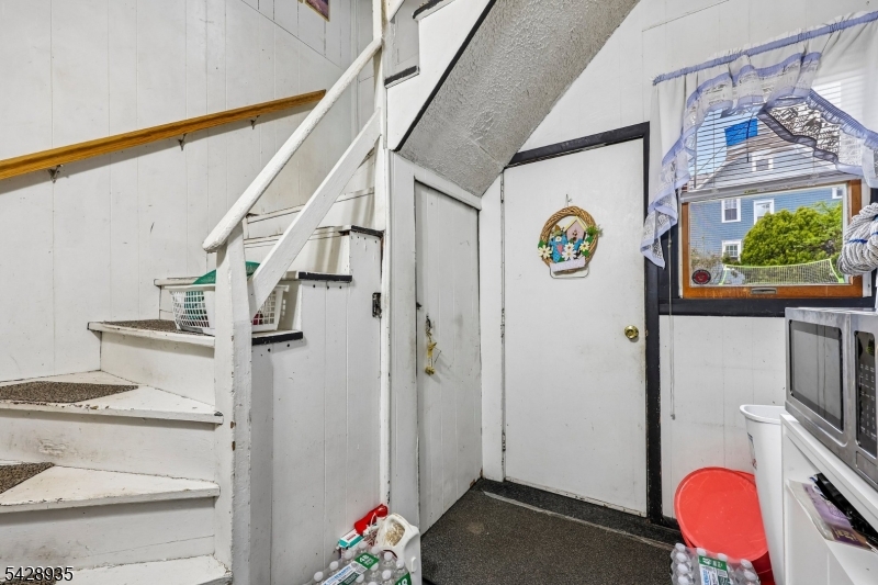50 Preston Street Ridgefield Park, NJ 07660 - Photo 6 of 41 a view of entryway with furniture and garden view