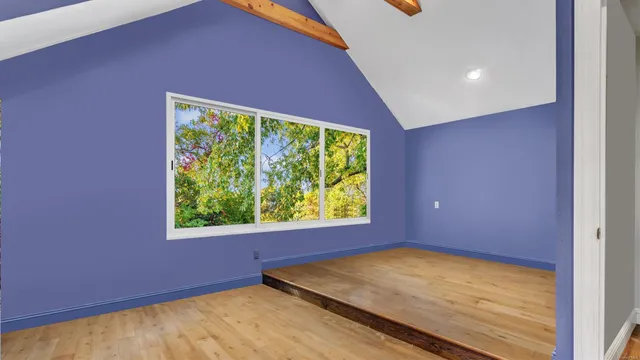 a living room with furniture tv and a flat screen tv