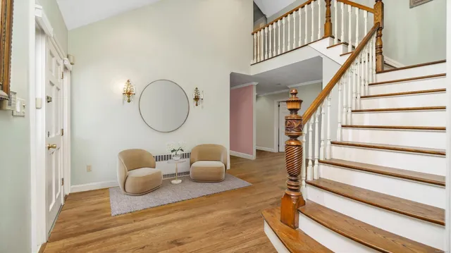 a view of a livingroom with furniture and staircase