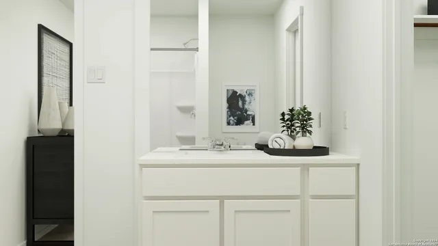 a bathroom with a sink and a mirror