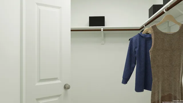 a bathroom with a shower and a mirror