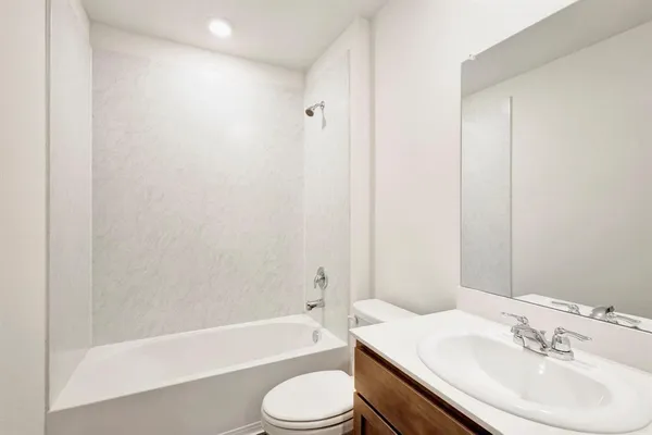 a bathroom with a sink toilet and bathtub