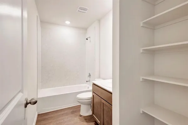 a bathroom with a toilet a sink and a bathtub