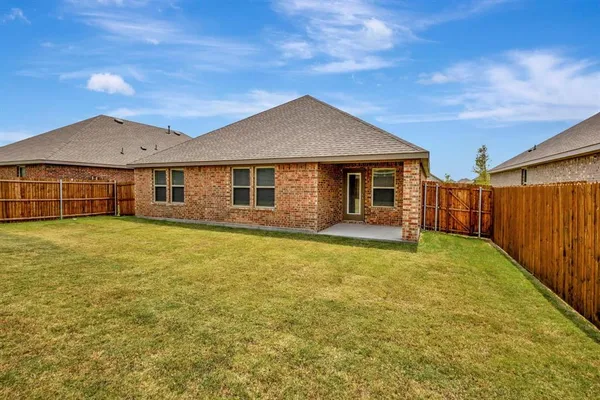 a front view of a house with yard