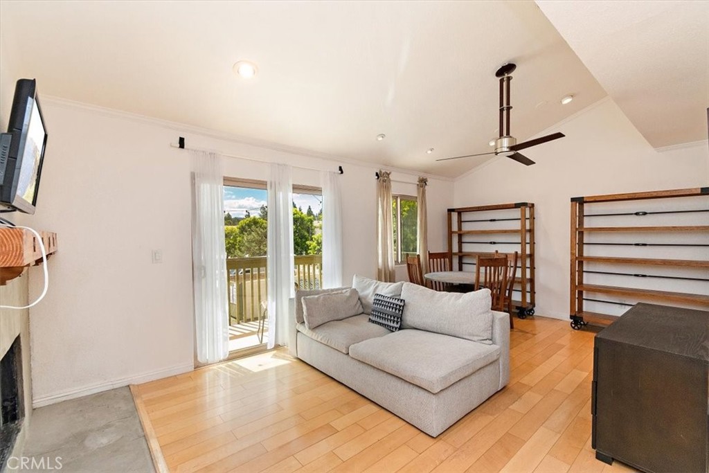 95 Tennessee Street, Unit F Redlands, CA 92373 - Photo 1 of 1 a living room with furniture and a flat screen tv