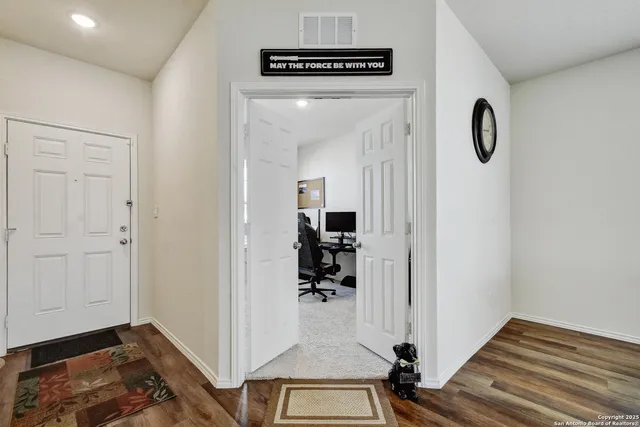 a view of a hallway with workspace