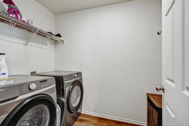 a utility room with dryer and washer