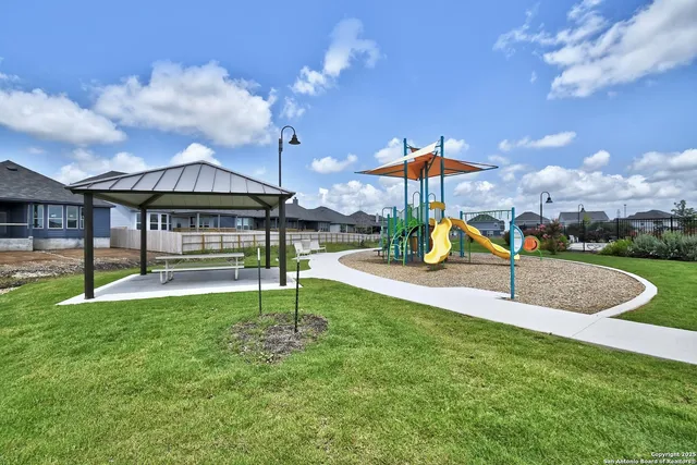 a view of a house with a swimming pool yard and sitting area