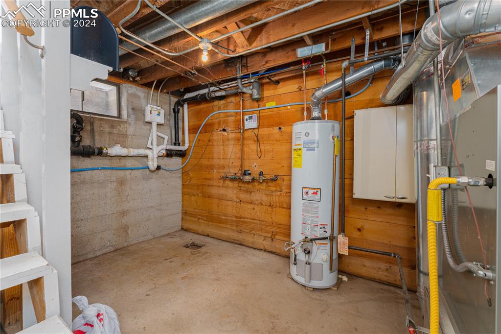 1002 Alexander Road Colorado Springs, CO 80909 - Photo 18 of 28 a view of a room with storage