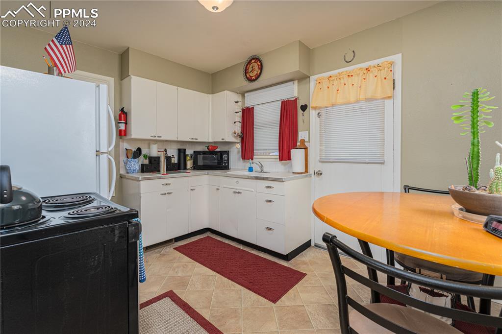 1002 Alexander Road Colorado Springs, CO 80909 - Photo 21 of 28 a room with storage and utility