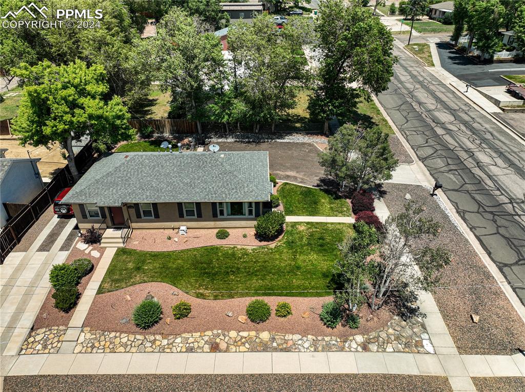 1002 Alexander Road Colorado Springs, CO 80909 - Photo 28 of 28 an aerial view of a house with garden