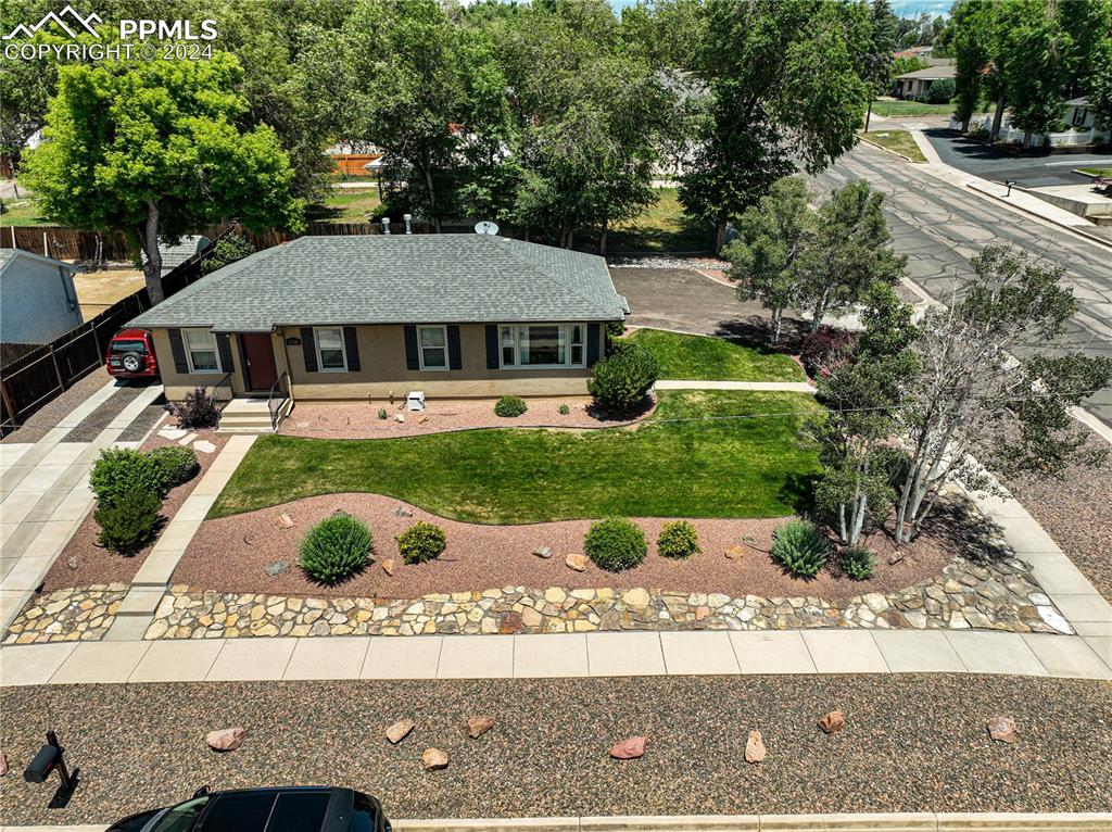 1002 Alexander Road Colorado Springs, CO 80909 - Photo 3 of 28 a view of house with yard
