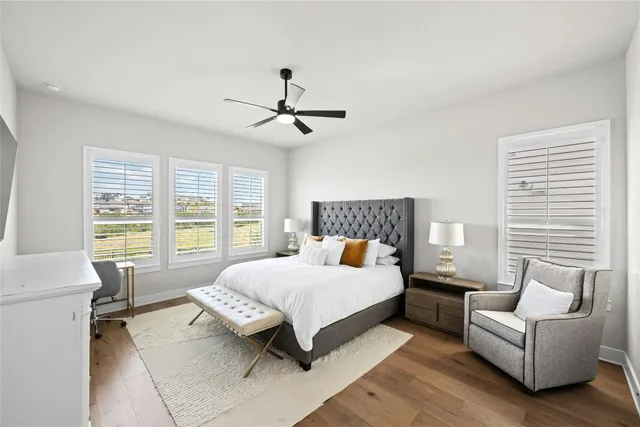 a large kitchen with a table and chairs