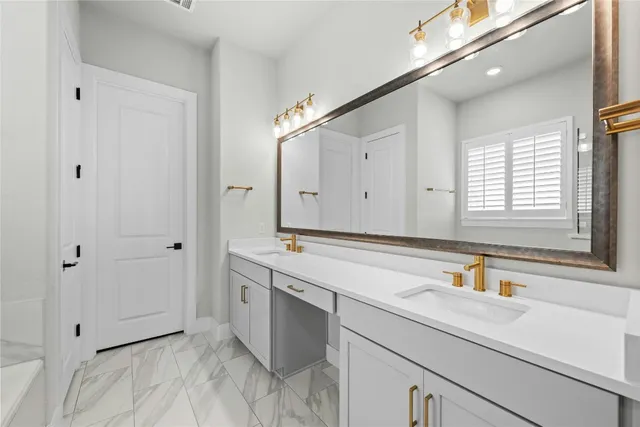 a bedroom with a bed tv and chair