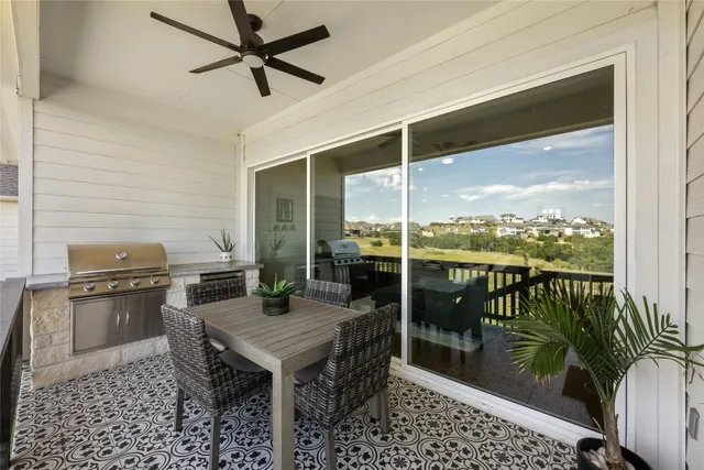 a view of a balcony with furniture
