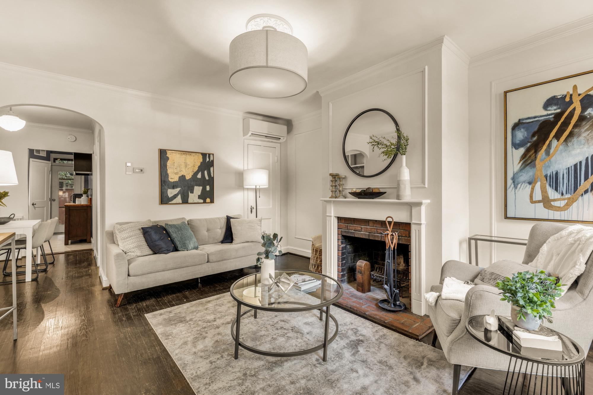 1127 C Street Southeast, Unit 2 Washington, DC 20003 - Photo 1 of 17 a living room with furniture fireplace and a fireplace