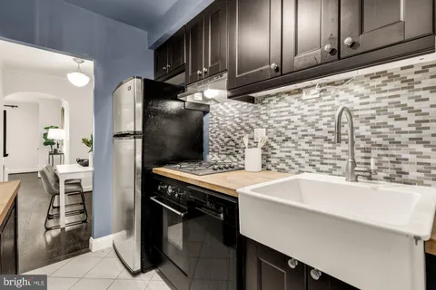 a kitchen with stainless steel appliances a refrigerator and a sink