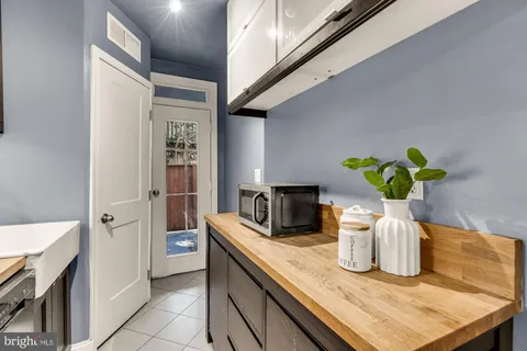 a kitchen with a sink a counter space and appliances