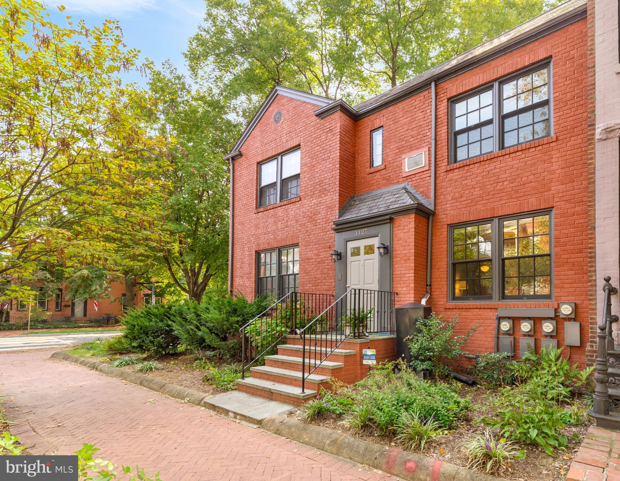1127 C Street Southeast, Unit 2 Washington, DC 20003 - Photo 2 of 17 a front view of a house with a yard