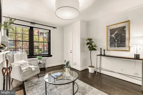 a living room with furniture and window