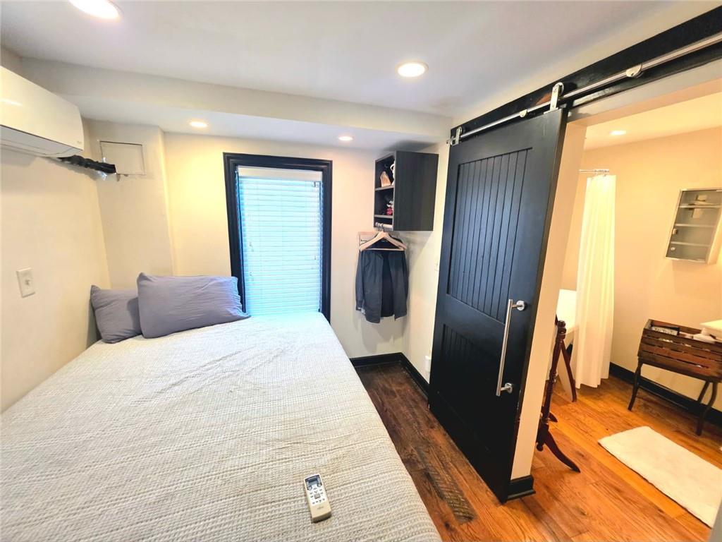 604 Middle Street Pittsburgh, PA 15212 - Photo 18 of 47 a bedroom with a bed and a couch