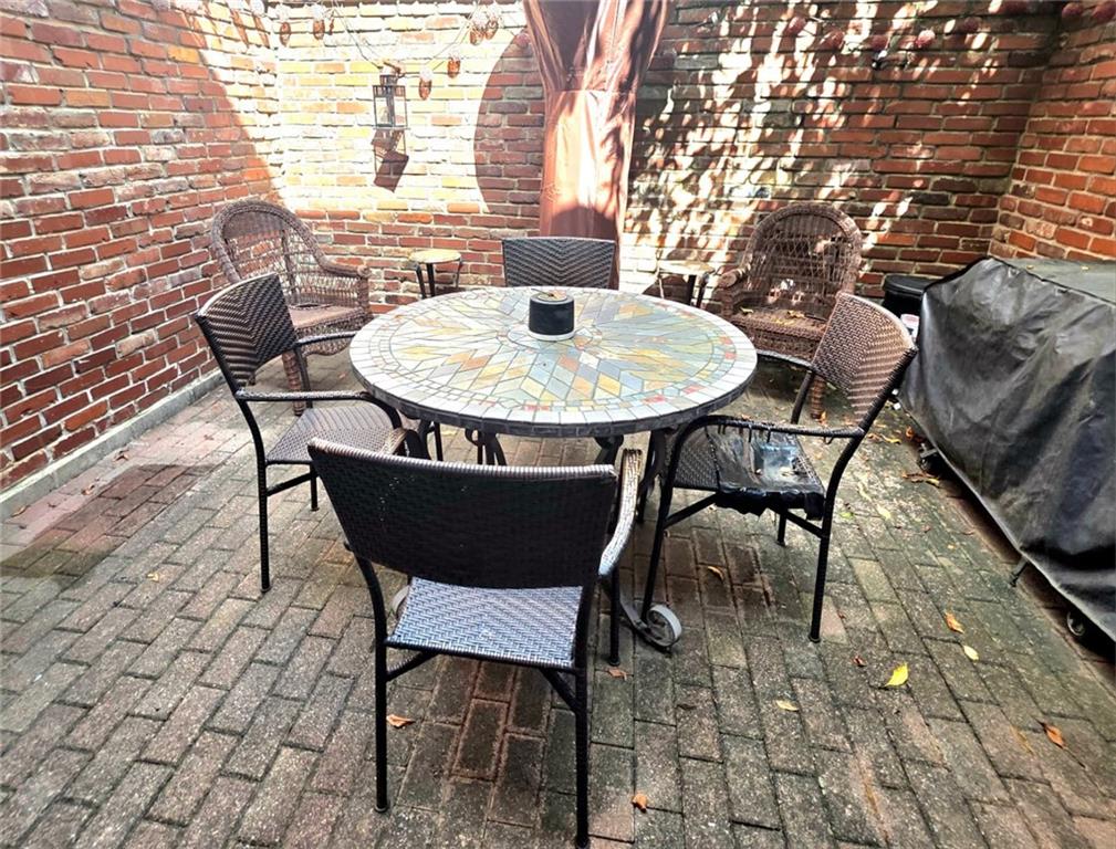 604 Middle Street Pittsburgh, PA 15212 - Photo 21 of 47 a table and chairs in a patio