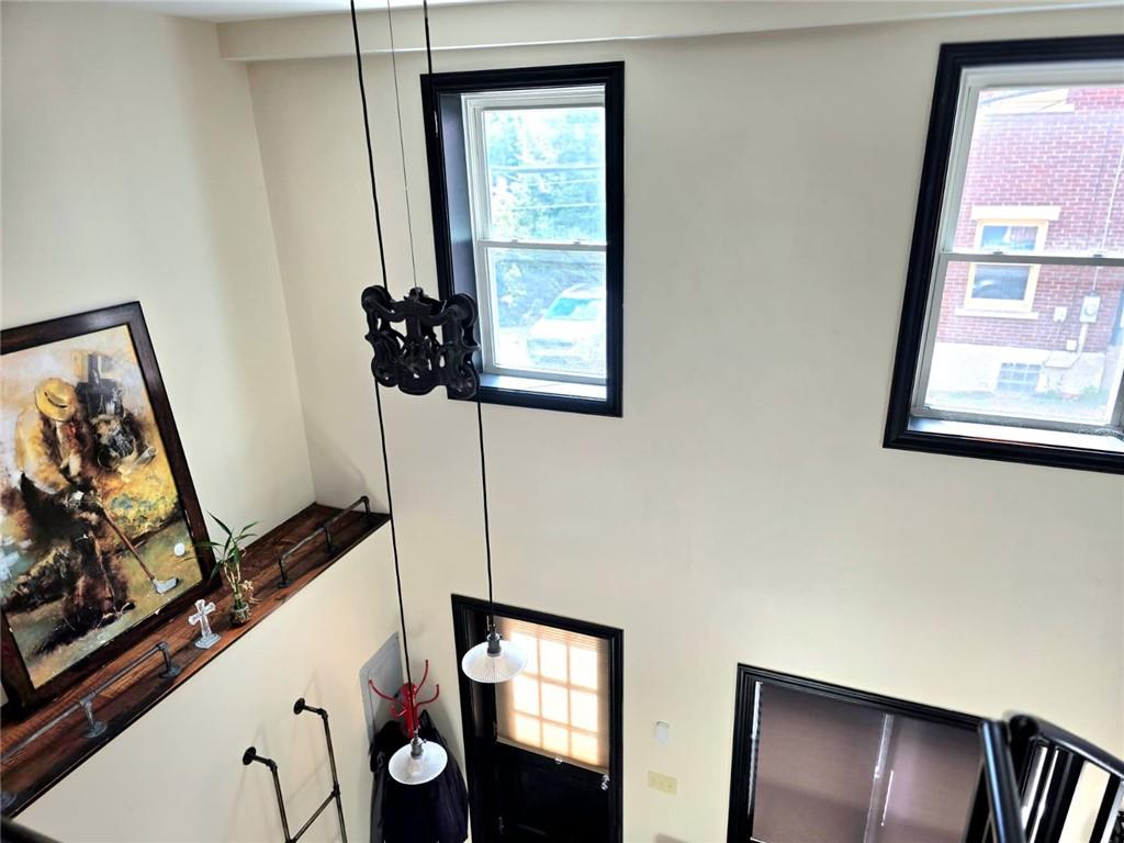 604 Middle Street Pittsburgh, PA 15212 - Photo 25 of 47 a view of a hallway with wooden floor and windows