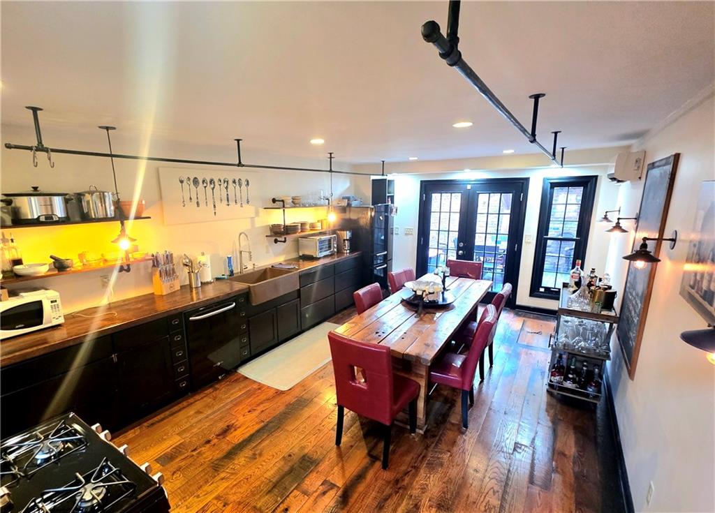 604 Middle Street Pittsburgh, PA 15212 - Photo 3 of 47 a view of a dining room with furniture window and wooden floor