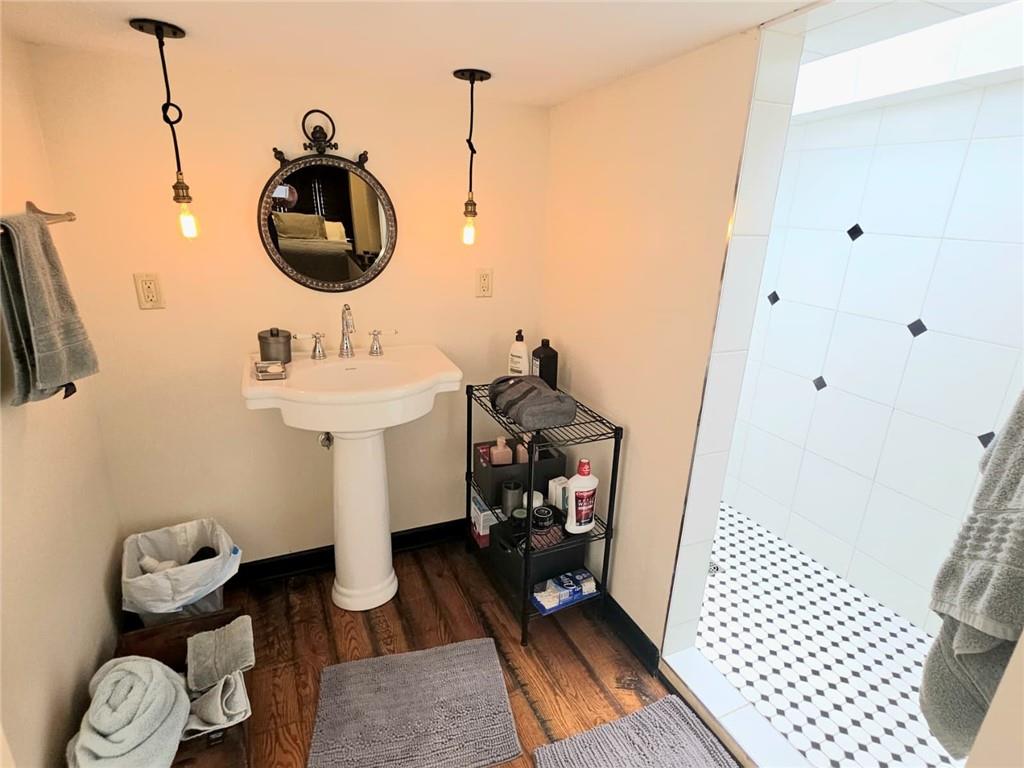 604 Middle Street Pittsburgh, PA 15212 - Photo 35 of 47 a bathroom with a sink and a mirror