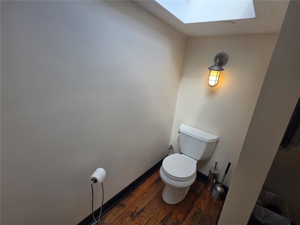 604 Middle Street Pittsburgh, PA 15212 - Photo 37 of 47 a white toilet sitting next to a bathroom sink and vanity