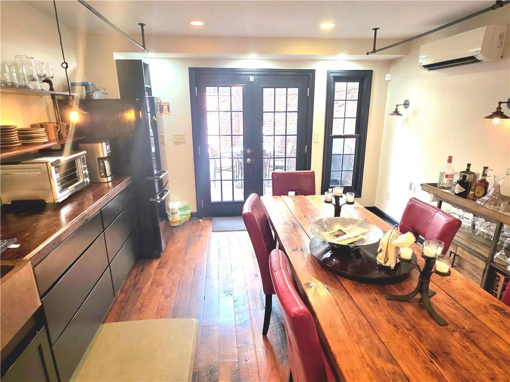 604 Middle Street Pittsburgh, PA 15212 - Photo 8 of 47 a dining room with furniture and wooden floor