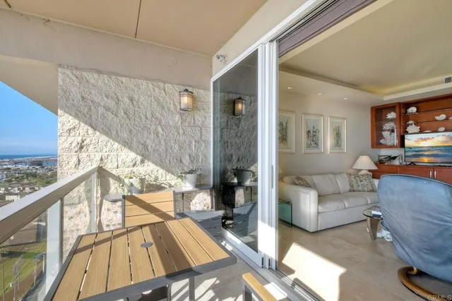 a view of a balcony with an ocean