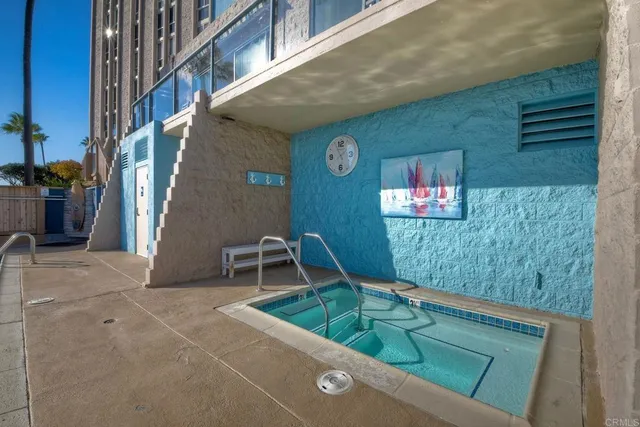 a dining room with furniture and a floor to ceiling window