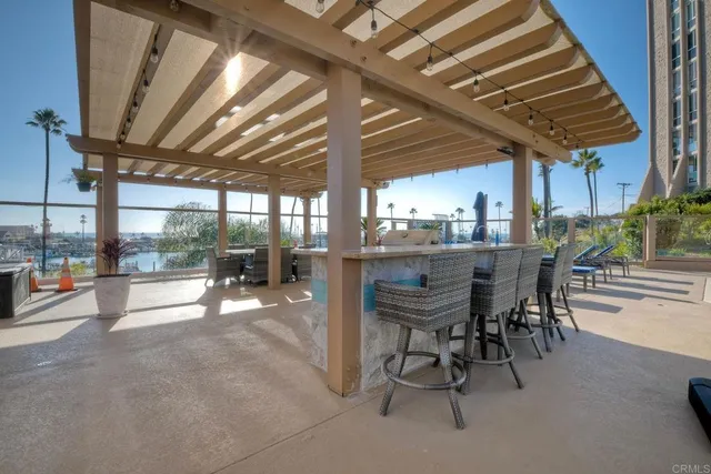 a view of a patio with table and chairs potted plants