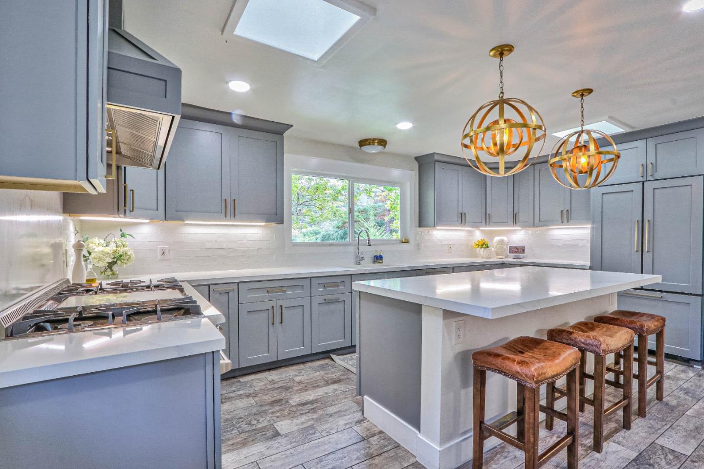 180 San Benancio Road Salinas, CA 93908 - Photo 9 of 27 a kitchen with stainless steel appliances granite countertop a sink a stove and a wooden floors