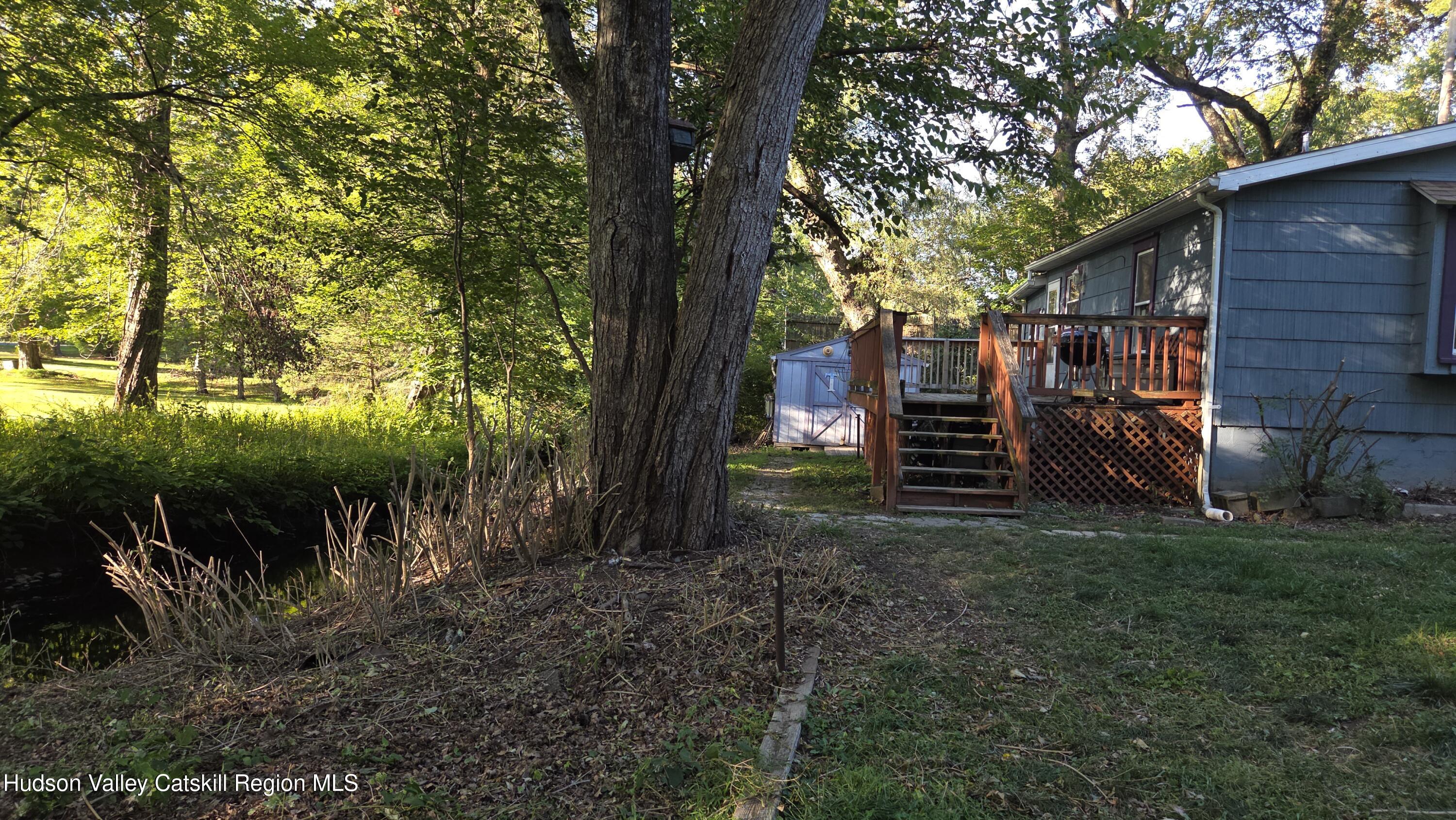 18 Kate Yaeger Road Saugerties, NY 12477 - Photo 13 of 16 a view of house with trees in the background