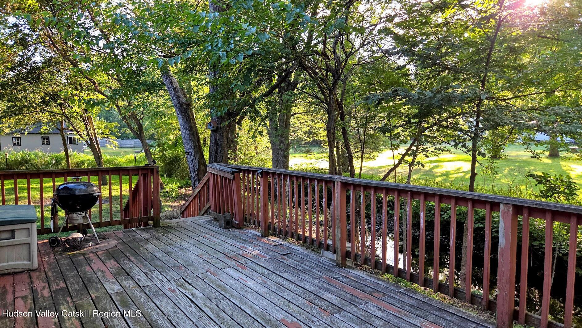 18 Kate Yaeger Road Saugerties, NY 12477 - Photo 15 of 16 a view of deck with wooden floor and outdoor seating