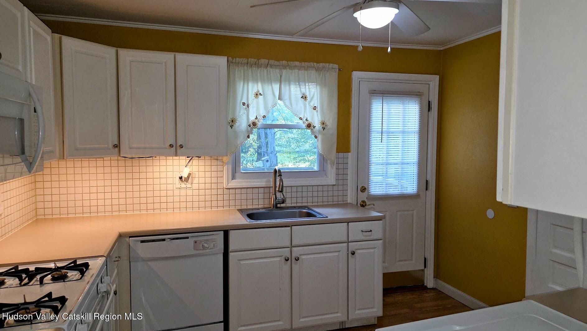 18 Kate Yaeger Road Saugerties, NY 12477 - Photo 4 of 16 a bathroom with a sink and a mirror
