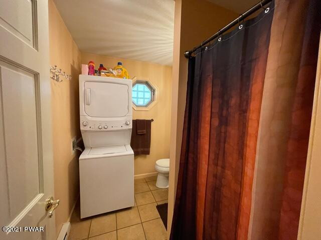 259 High Ridge Road Dingmans Ferry, PA 18328 - Photo 13 of 19 a bathroom with a toilet and a shower curtain